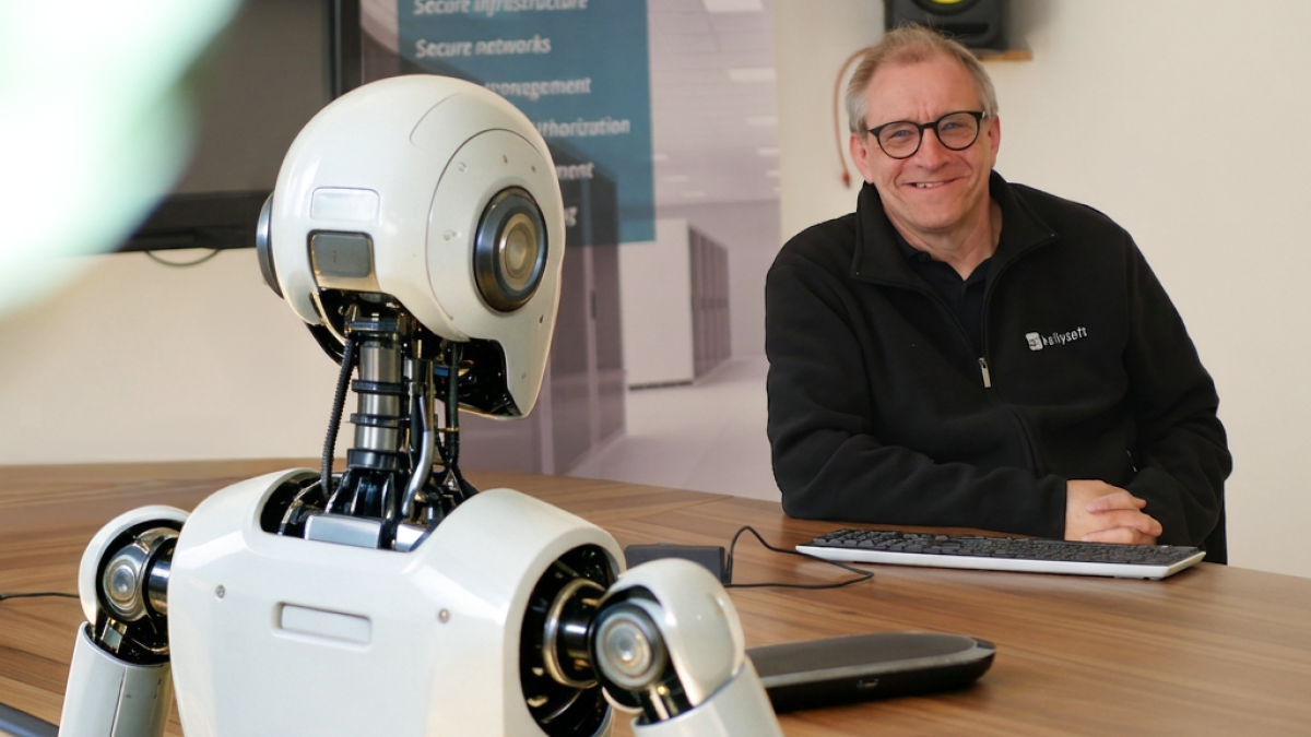 Geschäftsführer von Kallysoft sitzt einem Roboter gegenüber